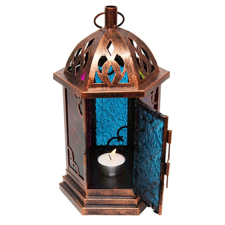 Metal lantern with a brushed copper finish an 6 glass windows in a contrasting stained finish. Door open showing tea light.