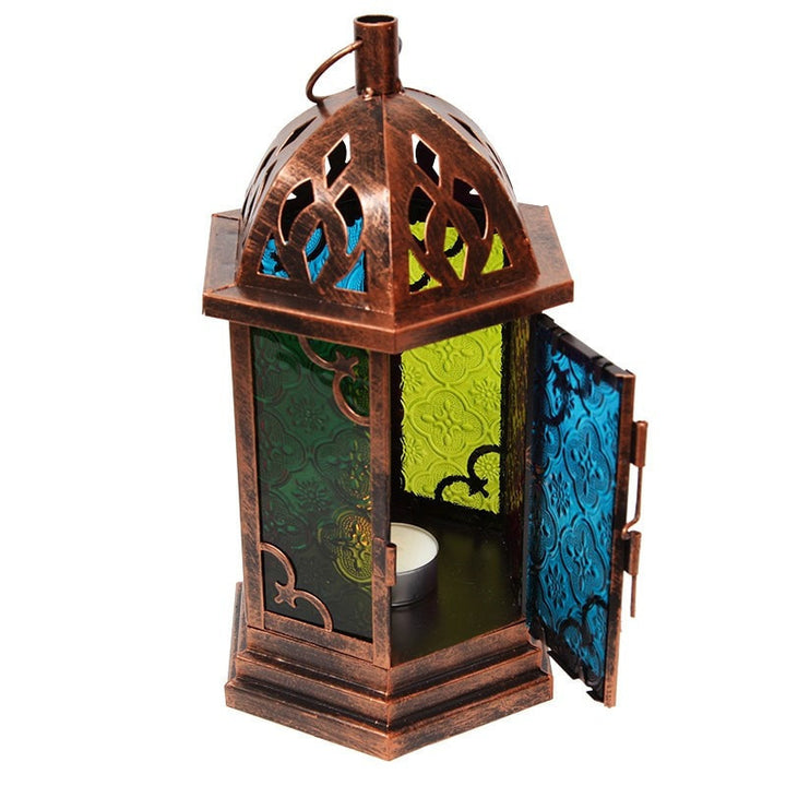 Metal lantern with a brushed copper finish an 6 glass windows in a contrasting stained finish. Door open showing tea light.