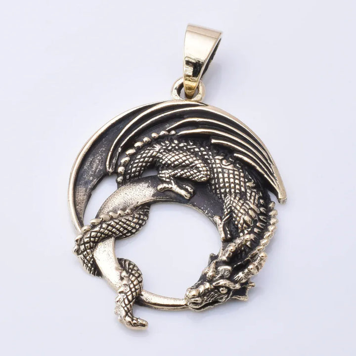 Solid bronze curled dragon pendant