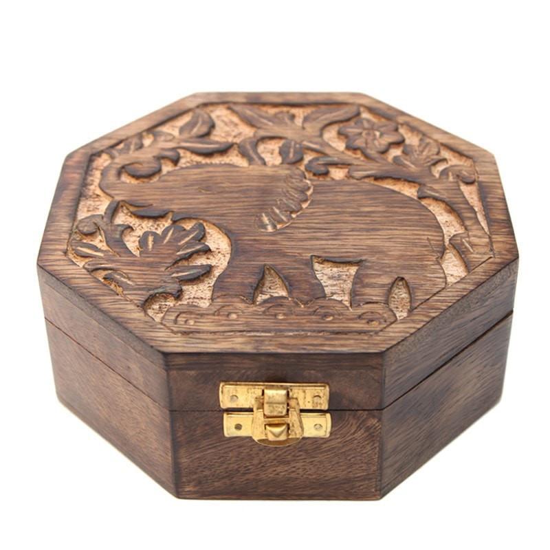 Octagonal wooden box with elephant carved on top