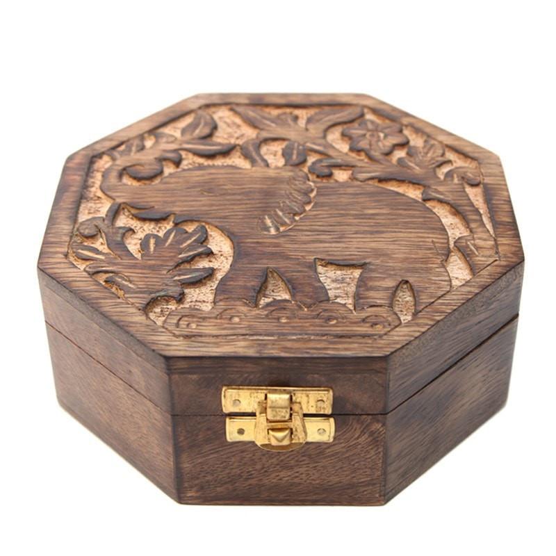 Octagonal wooden box with elephant carved on top