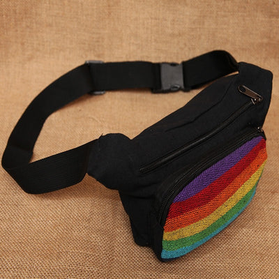 Rainbow Festival Bum Bag, mainly black with a front rainbow pannel, two zip pockets and adjustable waist strap
