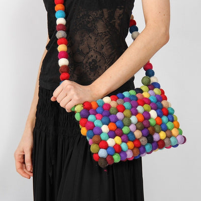 Handmade Felt Ball Cross Body Bag - Multi Coloured, Modelled close up